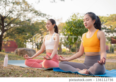 Fit woman practicing yoga outdoor. Calmness and relax. fitness, yoga training, lifestyle. 136112736