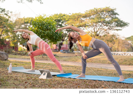 Fit woman practicing yoga outdoor. Calmness and relax. fitness, yoga training, lifestyle. 136112743