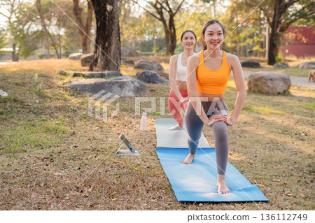 Fit woman practicing yoga outdoor. Calmness and relax. fitness, yoga training, lifestyle. 136112749