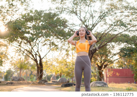 Two fit woman using smartphone playing social media after yoga training. lifestyles and healthcare. Two fit woman using smartphone playing social media after yoga training. lifestyles and healthcare. 136112775