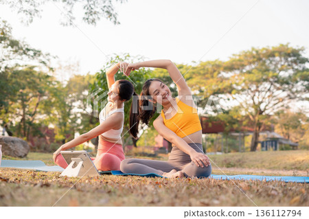 Fit woman practicing yoga outdoor. Calmness and relax. fitness, yoga training, lifestyle. 136112794