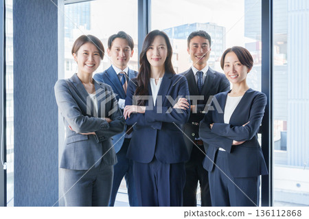Business people working in the office looking at the camera Business people working in the office looking at the camera 136112868