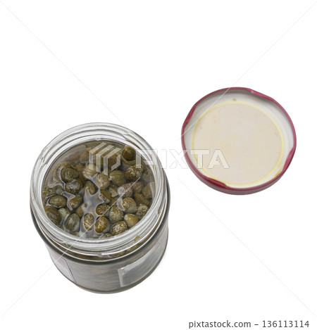 a glass jar with capers in vinegar a glass jar with capers in vinegar 136113114