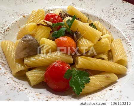 Rotini pasta with meat, mushrooms and tomatoes 136113212