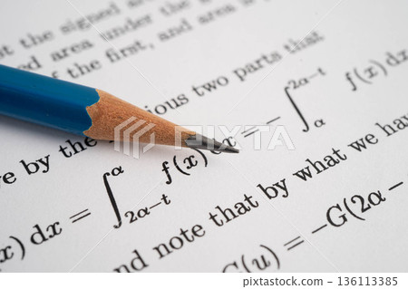 Pencil on mathematic formula exercise test paper in education school. Pencil on mathematic formula exercise test paper in education school. 136113385