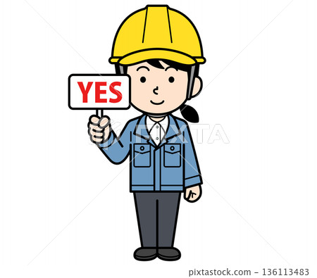 A female site supervisor wearing a helmet holding a YES sign 136113483