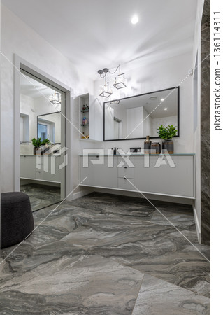 Luxurious modern hallway with marble floor and minimalist white console 136114311