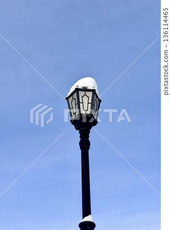 city street lamp on the background of the blue sky in winter city street lamp on the background of the blue sky in winter 136114465