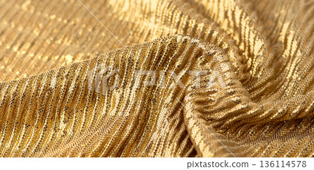A close-up shot of gold sequin fabric A close-up shot of gold sequin fabric 136114578