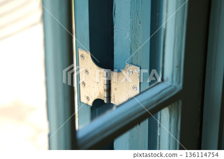 Old hinges on window shutters Old hinges on window shutters 136114754