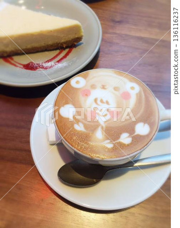 Cute latte art of a girl wearing a bear hat 136116237