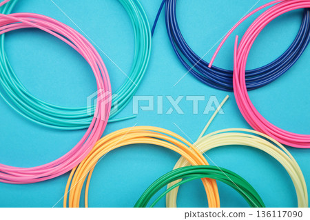 3d pen for creating volume plastic figures on blue background. 3d pen for creating volume plastic figures on blue background. 136117090