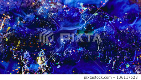 Paint spill defocused. Ink spread. Sparkling blue dye abstract curl flow on acrylic texture. Colorful flare confetti wave stream background. 136117528