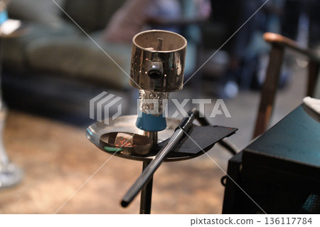 Shisha charcoal and pipe. Close-up of preparation for hookah smoking. 136117784