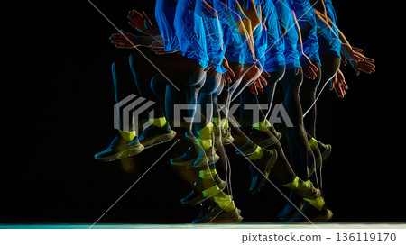 Runner airborne phase stroboscopic on black background. 136119170