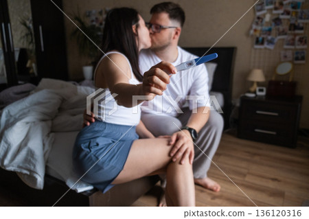 Happy Couple Celebrating Positive Pregnancy Test 136120316