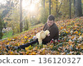 Father and baby enjoying autumn outdoors 136120327
