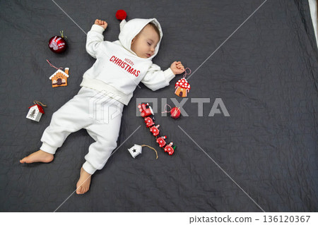 Sleeping Baby in Christmas Outfit 136120367