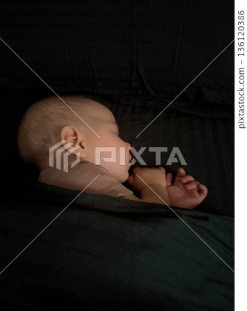 Peaceful Baby Sleeping Under Blanket 136120386
