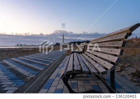 Migita Beach in the morning glow, benches and a quiet seaside promenade 136120401