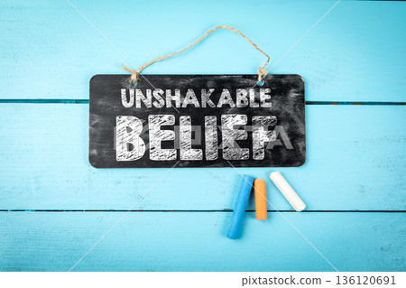 Unshakable Belief Concept Sign On Blue Wooden Background 136120691