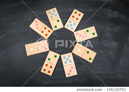Wooden Domino Tiles Arranged In Circular Pattern On Dark Background Wooden Domino Tiles Arranged In Circular Pattern On Dark Background 136120701
