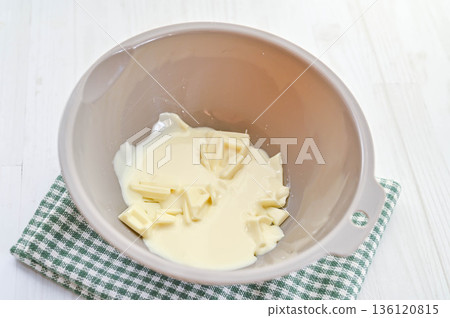 Melt the chocolate in a double boiler 136120815