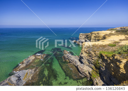 Clear Atlantic ocean water washing Odemira cliffs Clear Atlantic ocean water washing Odemira cliffs 136120843