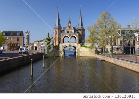 Waterpoort gatehouse spanning canal in Sneek, Netherlands 136120915