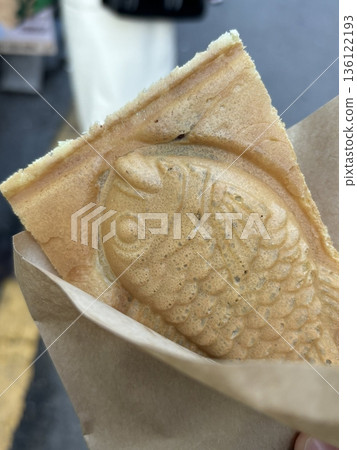 Bungeoppang, bungeo-ppang (Korean Fish Shaped Pastry), popular snack, cookies, sweet in winter streets of Korea. Bungeoppang Korean traditional national food, dish, cuisine. Japanese taiyaki 136122193
