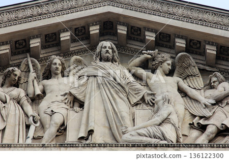 The sculpted tympanum of the church "La Madeleine", Paris 136122300