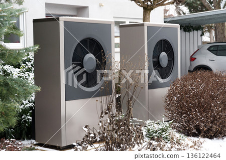 Outdoor heat pump units in residential area during winter 136122464