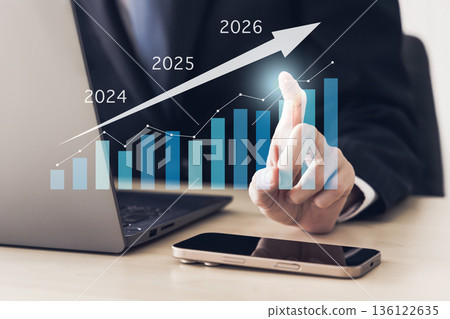 Businessman economic bar graph rising arrow 136122635