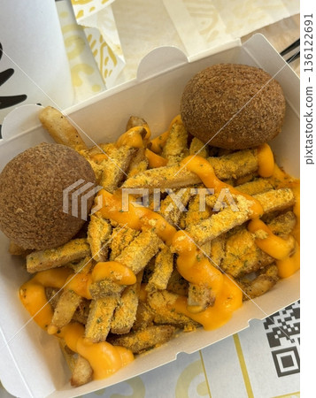 Crispy Korean fried chicken, perfectly glazed with a sweet and spicy sauce. Ideal for food photography and menus, showcasing the irresistible crunch and flavor of this beloved dish. Crispy Korean fried chicken, perfectly glazed with a sweet and spicy sauce. Ideal for food photography and menus, showcasing the irresistible crunch and flavor of this beloved dish. 136122691