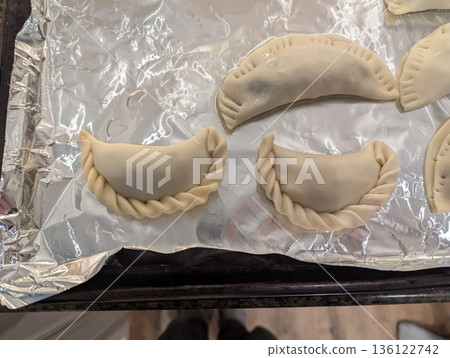 Korean dumplings filled with a mix of savory ingredients like ground meat, tofu, and vegetables. Mandu can be steamed, boiled, or pan-fried, making it a versatile and delicious snack or meal. Korean dumplings filled with a mix of savory ingredients like ground meat, tofu, and vegetables. Mandu can be steamed, boiled, or pan-fried, making it a versatile and delicious snack or meal. 136122742