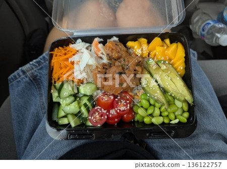 Fresh salad with a mix of crisp leafy greens, sliced vegetables, and colorful ingredients, tossed together to create a healthy, vibrant, and refreshing dish full of natural flavors 136122757