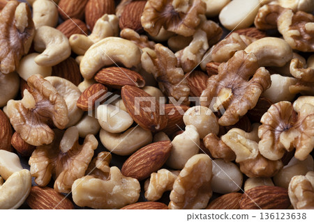 Mixed nuts in a wooden bowl Mixed nuts in a wooden bowl 136123638