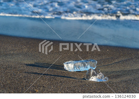 Jewelry ice washing up on Otsu Coast, Tokachi River Estuary, Hokkaido, Japan. 136124030
