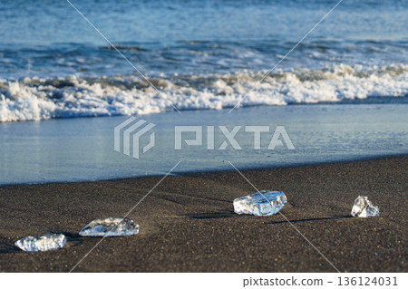 Jewelry ice washing up on Otsu Coast, Tokachi River Estuary, Hokkaido, Japan. Jewelry ice washing up on Otsu Coast, Tokachi River Estuary, Hokkaido, Japan. 136124031