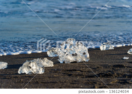 Jewelry ice washing up on Otsu Coast, Tokachi River Estuary, Hokkaido, Japan. Jewelry ice washing up on Otsu Coast, Tokachi River Estuary, Hokkaido, Japan. 136124034