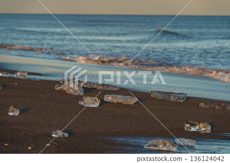 Jewelry ice washing up on Otsu Coast, Tokachi River Estuary, Hokkaido, Japan. 136124042