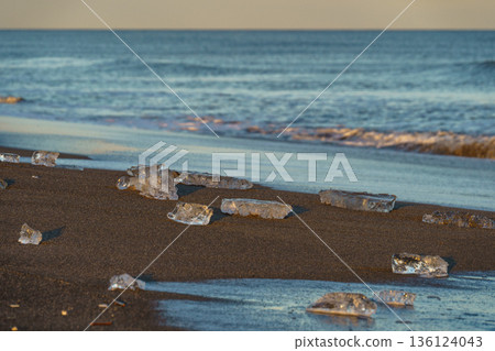 Jewelry ice washing up on Otsu Coast, Tokachi River Estuary, Hokkaido, Japan. 136124043