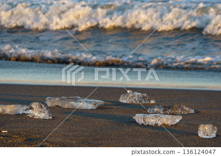 Jewelry ice washing up on Otsu Coast, Tokachi River Estuary, Hokkaido, Japan. 136124047