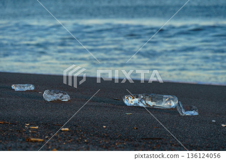 Jewelry ice washing up on Otsu Coast, Tokachi River Estuary, Hokkaido, Japan. Jewelry ice washing up on Otsu Coast, Tokachi River Estuary, Hokkaido, Japan. 136124056