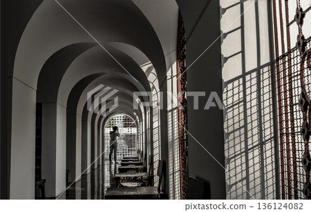 A Woman takes pictures with a camera inside the Metal Palace, Metal Castle at Wat Ratchanaddaram. 136124082