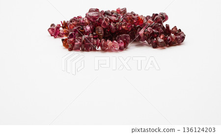 Red spinel chip stone macro photography white background 136124203