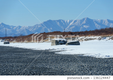 Snow-covered pillboxes at Asahihama, remains of coastal defenses in Taiki Town, Hokkaido 136124447
