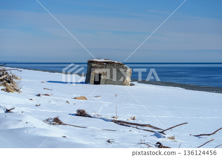 Snow-covered pillboxes at Asahihama, remains of coastal defenses in Taiki Town, Hokkaido 136124456