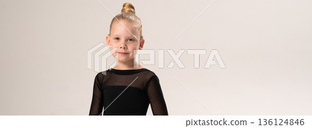 Portrait of child with cochlear implant during dance practice in studio. Banner with copy space. Hearing loss treatment, auditory rehabilitation, assistive medical device, emotional adaptation, and 136124846