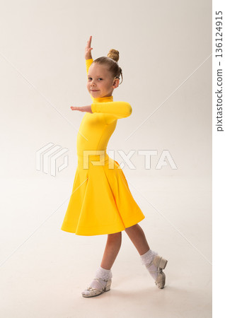 Close-up portrait of child with cochlear implant during dance practice. Hearing loss treatment, auditory rehabilitation, assistive medical technology, emotional adaptation, and inclusive healthcare 136124915